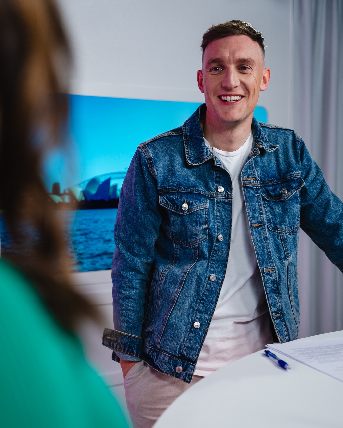 Lee smiling in the television studio