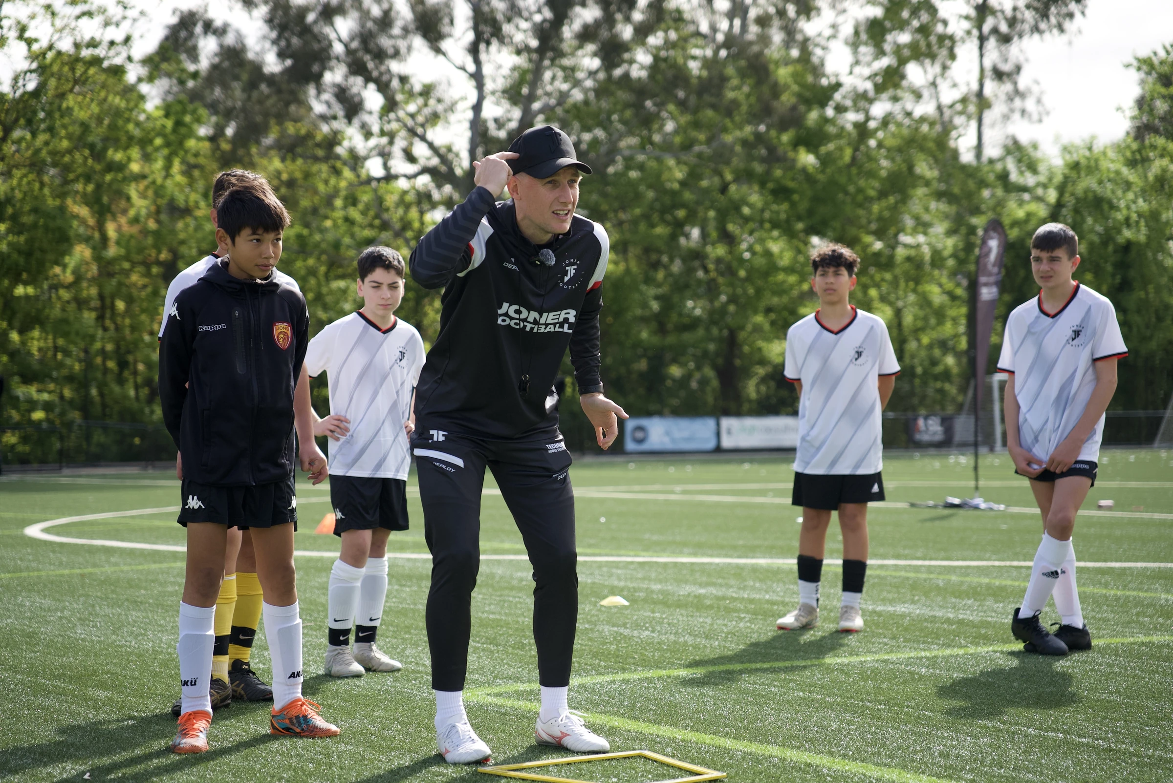 Lee Jones coaching players at a Joner Football camp