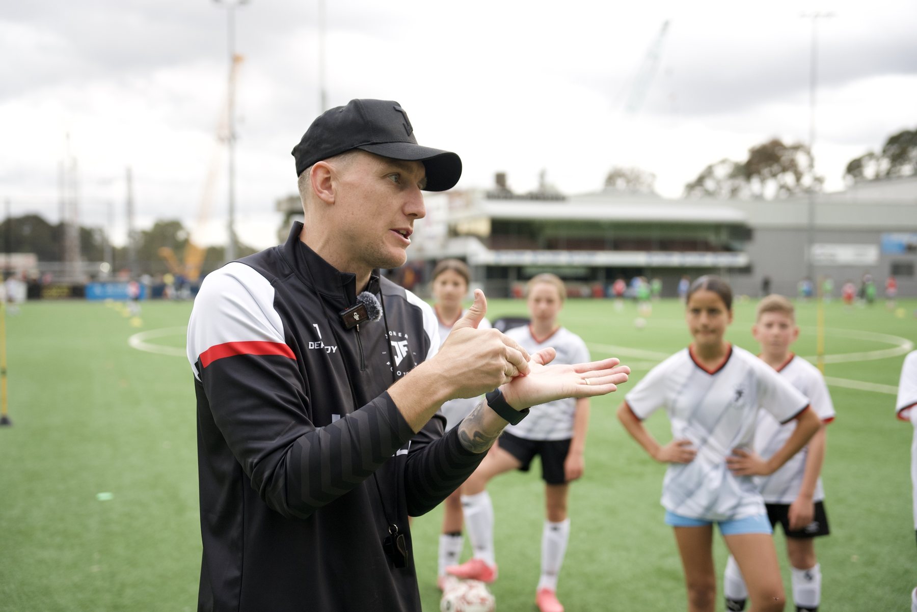 Lee Jones coaching a group at Joner Football