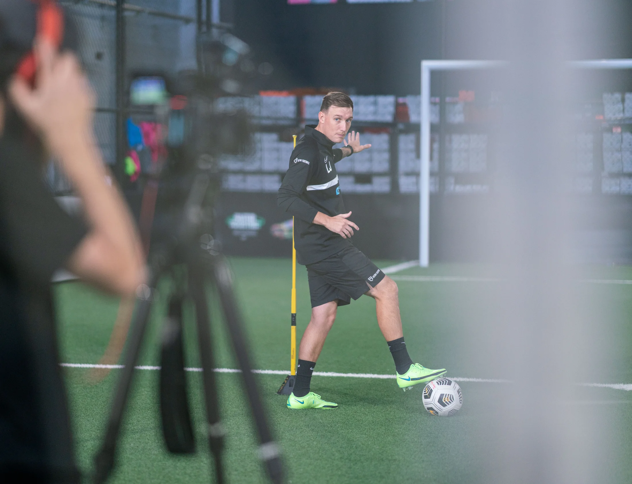 Lee Jones coaching a technical ball mastery drill indoors