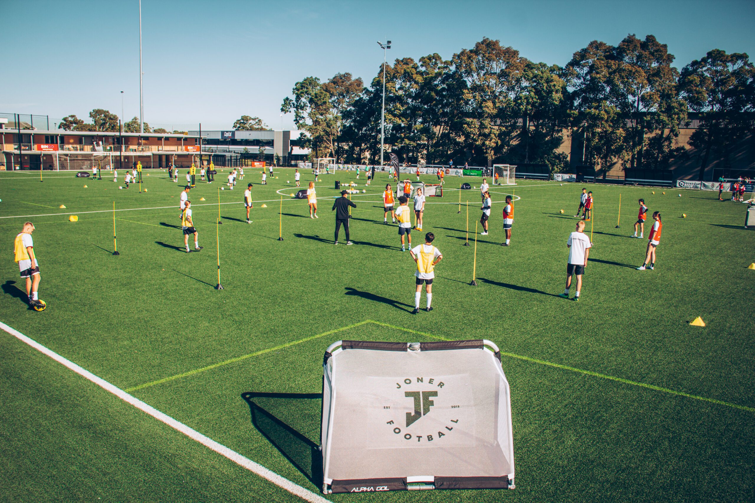 Joner Football players training at a large outdoor camp