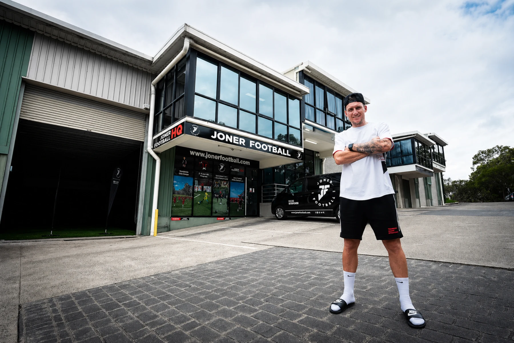 Lee Jones standing outside the Joner Football HQ facility in Belrose