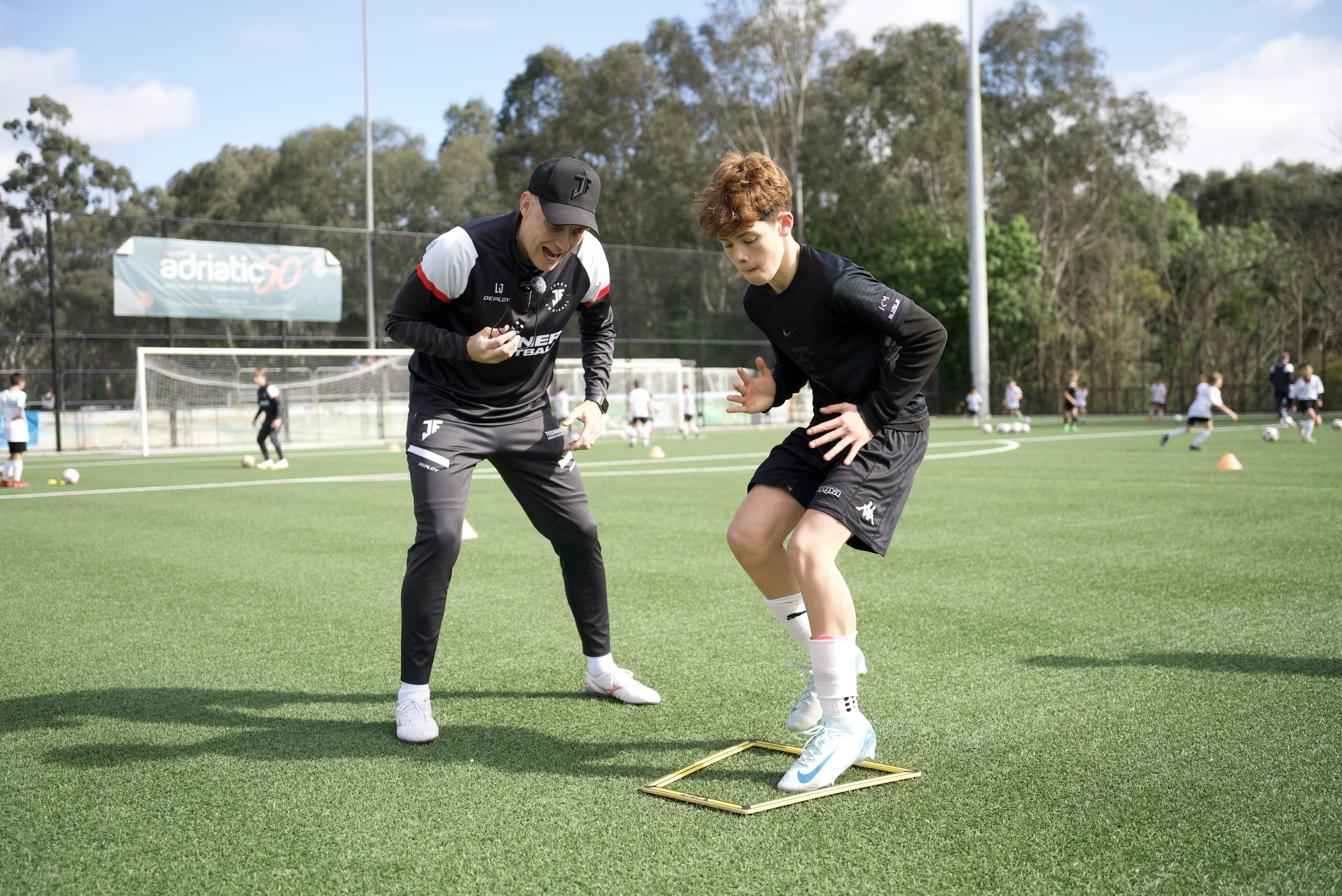 Joner Football coach working directly with a player at JFP