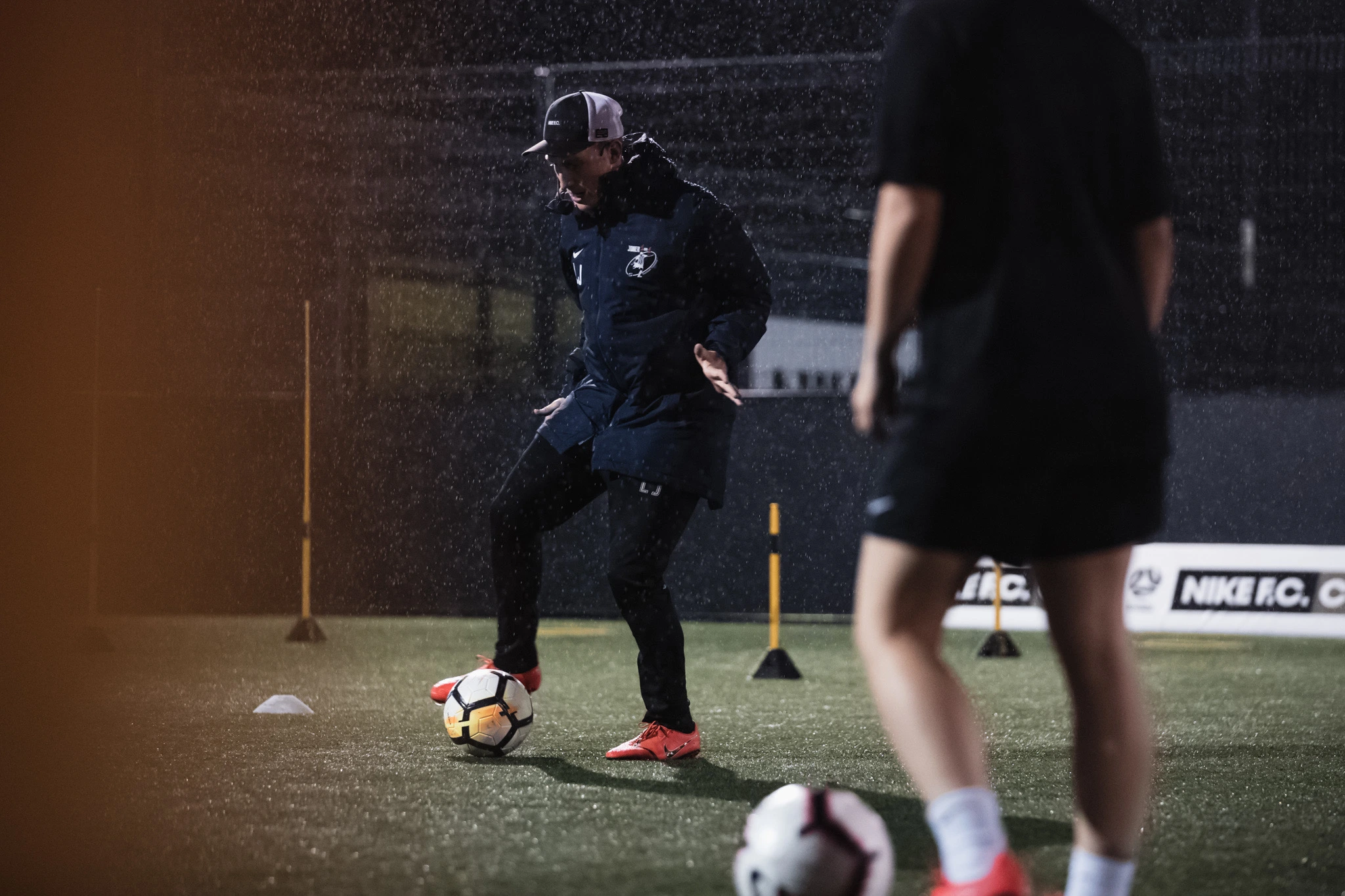 Lee Jones coaching a professional player in an action session
